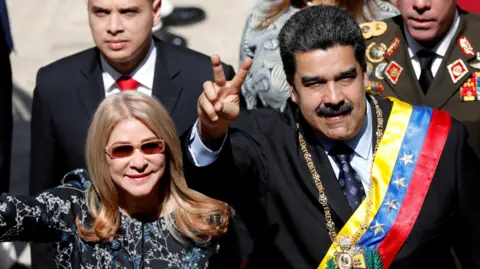 Reuters Venezuela's President Nicolas Maduro and First Lady Cilia Flores
